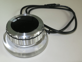 Classic haptic rotary push button with a metallic finish and cable connection