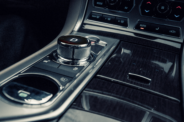 Haptic rotary push button integrated into a car's center console for intuitive control