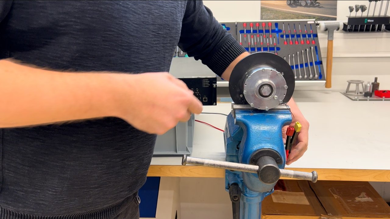 Pulse test of the INVENTUS MR brake WP in the lab: the brake is clamped in a vice with a torque wrench on the shaft